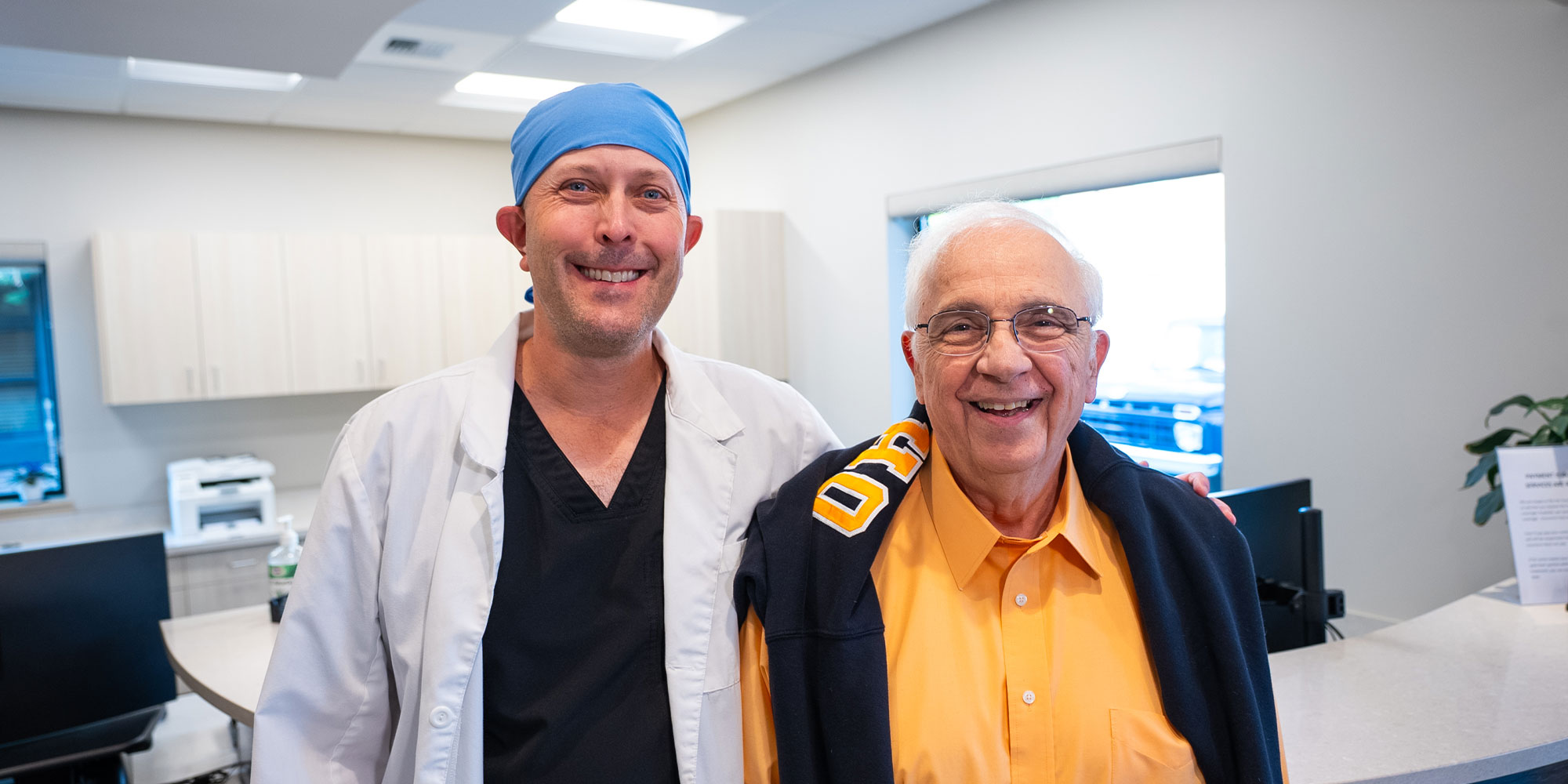 patient and doctor both smiling brightly after patients treatment