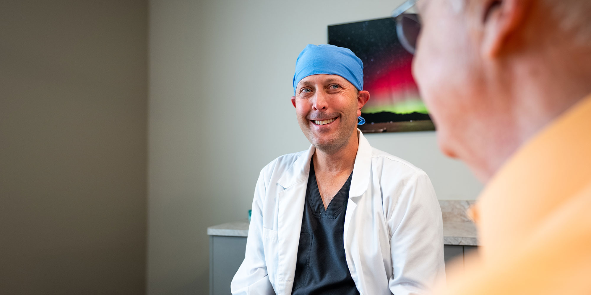 doctor going over dental procedure information with root canal patient